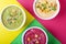 Colorful hummus in the white bowls against the geometric background