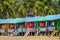 Colorful huts on the sandy beach in Goa