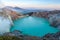 Colorful Ijen volcano crater lake and Raung.