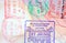 Colorful immigration arrival stamps on passport