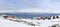 Colorful inuit houses at the fjord full of icebergs in a suburb