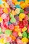 Colorful jellies and candies sweets heart-shaped background