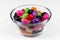 Colorful jelly beans multi color bean candy bowl isolated white