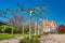 Colorful Johannis church, platan trees and flowers at early Spring in Magdeburg, Germany