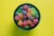 Colorful jujubes in glass bowl top view