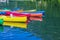 Colorful kayak boats resting on the lake in a nautical school about to slip from Huesca Spain