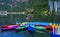 Colorful kayak boats resting on the lake in a nautical school about to slip from Huesca Spain