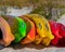 Colorful kayaks on the beach awaiting rental by active people or vacationers