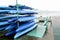 Colorful Kayaks and canoes in a Row stack