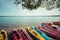 Colorful kayaks moored on lakeshore, Goldopiwo Lake, Mazury, Pol