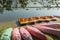 Colorful kayaks moored on lakeshore, Goldopiwo Lake, Mazury, Pol