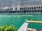 Colorful kayaks pass an electric boat as tourists enjoy recreational activities on the Chicago River