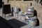 Colorful kegs of beer at the exit of a pub, on a brick wall