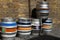 Colorful kegs of beer at the exit of a pub, on a brick wall