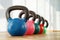 Colorful kettlebells in gym