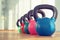 Colorful kettlebells in gym