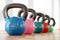 Colorful kettlebells in gym