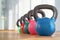 Colorful kettlebells in gym