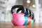 Colorful kettlebells in gym