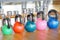 Colorful kettlebells in gym