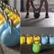 Colorful kettlebells in a row