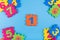 Colorful kids numbers toys on blue background