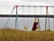 Colorful kids swings on the coast line in Kuujjuaq