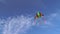 Colorful Kite Flying in Blue Cloudy Sky