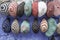 Colorful knit hats hanged on wall