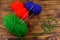 Colorful knitting yarns and knitting needles on wooden table