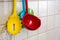 Colorful ladles hanging on a wall