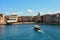 Colorful Lakeside view of the Italian Portofino Bay Hotel. Boat guest transportation arriving in