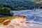 Colorful landscape of a flooded church in toxic polluted lake due to copper mining