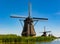 Colorful landscape in Netherlands, Europe. Famous windmills in Kinderdijk village