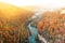 Colorful landscape perspective view from mountains to river and village in autumn