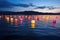 colorful lanterns floating on a calm lake