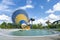 Colorful large cone slider and pool at amusement water park or aquapark in beautiful cloudy and blue sky day