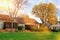 Colorful leaves in the autumn park/ Beautiful house in the sunny day.