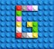 Colorful letter G from building lego bricks on blue lego background. Lego letter M