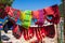 Colorful life jackets hanging on the beach, water safety concept.