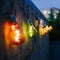 Colorful light bulbs on a urban terrace or a balcony at night. Eventing, gardening and decoration concept