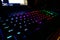 Colorful light Gaming Red Green Blue RGB Keyboard. Dark cool gamer equipment gear, night mode, modern high technology, close up