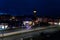 Colorful light stripes of cars on the street at night in front of a church in the city of plauen