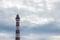 Colorful lighthouse against the sky