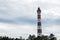 Colorful lighthouse against the sky