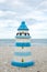 Colorful lighthouse ceramic doll on beach