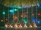 Colorful lights of garlands, fir cones and candles on the background of old barn boards