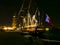 Colorful lights on masts sailboats surrounding blurred