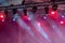 Colorful lights of projectors on outdoor concert stage