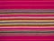 The colorful linear patterns of a cloth dishtowel